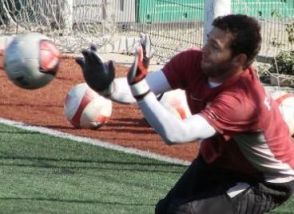 Goalie using hands to block shot