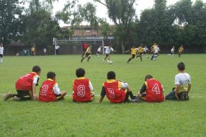 Soccer subs waiting to come into game