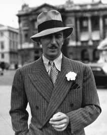 Young Walt Disney in a suit and hat