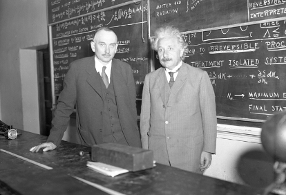 Photo of Einstein in front of chalkboard at Cal Tech