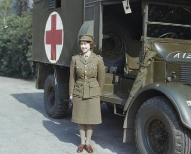 The Princess standing by a Red Cross truck