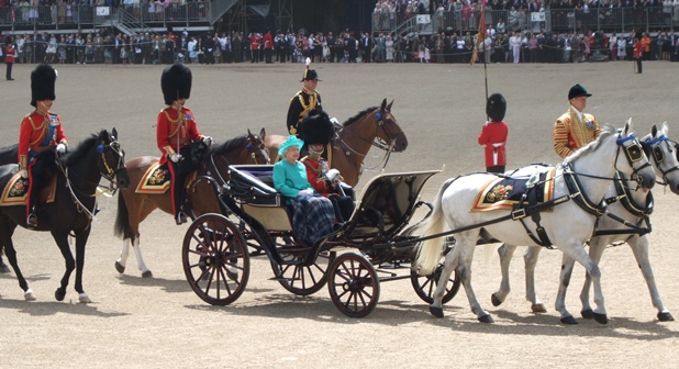 The queen riding a carriage