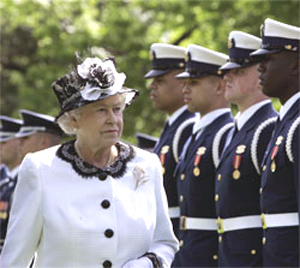 Queen Elizabeth walking in front of troops
