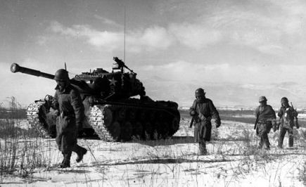 US Tanks advance and soldiers alongside