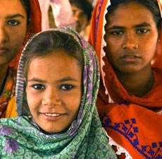 Three girls wearing colorful Hijabs