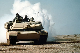 Soldiers riding tank during Gulf War