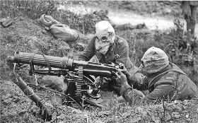 Machine gunners wearing gas masks
