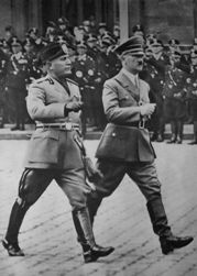 Mussolini walking with Adolf Hitler in Berlin by Unknown