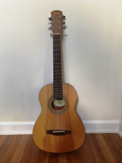 guitar leaning against wall