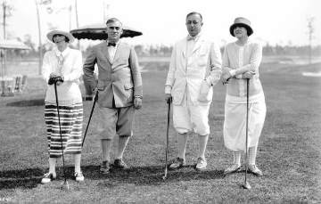 Two couples ready to play golf