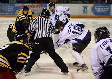 Faceoff in hockey started by the ref