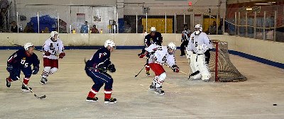 Hockey players playing defense