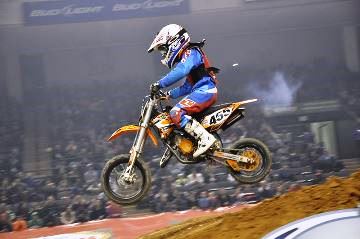 Rider taking jump in motocross