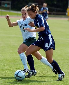 Soccer players going after the ball