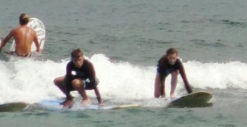 Two people surfing